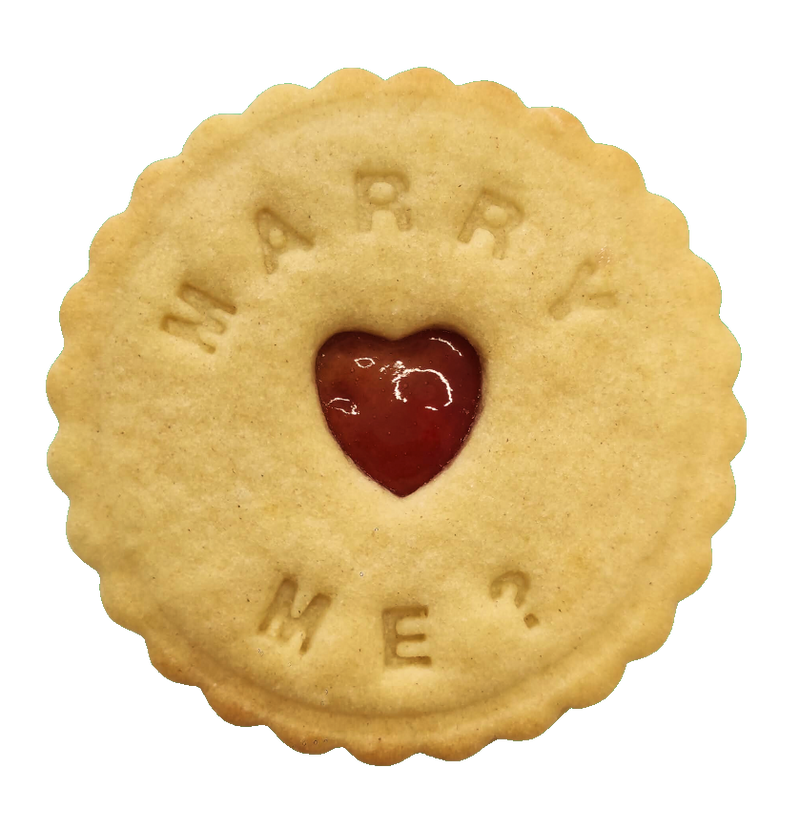 Handcrafted biscuit featuring the message 'Marry me,' created by The Biskery.