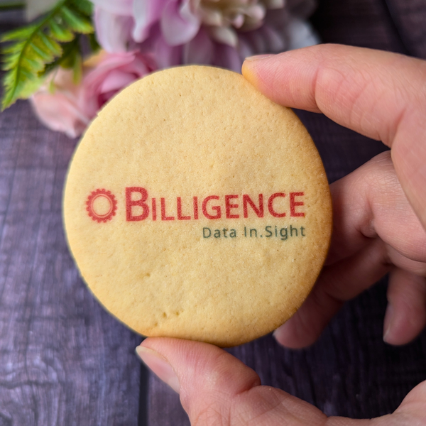 A hand holding a branded butter biscuit with the Billigence logo and tagline "Data In.Sight."