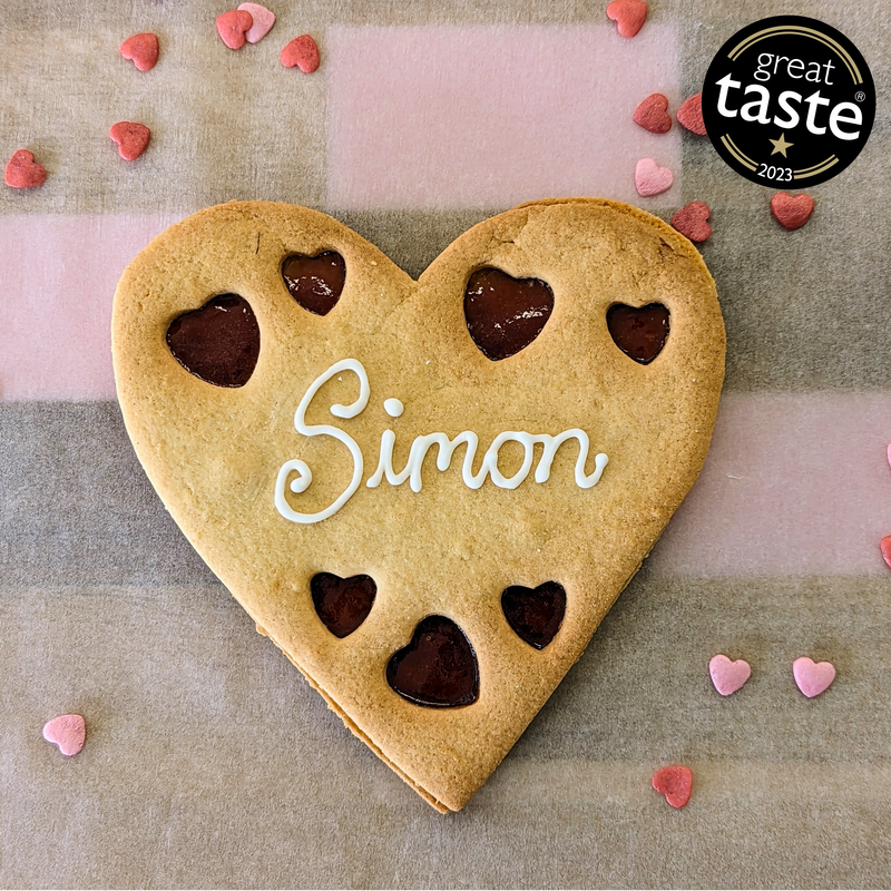 Giant Personalised Heart Cookie with the name Simon on it has.