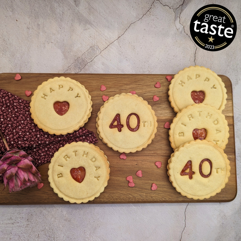 A plate of biscuits with the words "Happy 40th Birthday" written on them.