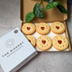  Onboarding gift of 6 heart-shaped jam biscuits with "Welcome" and "To the Team" messages.