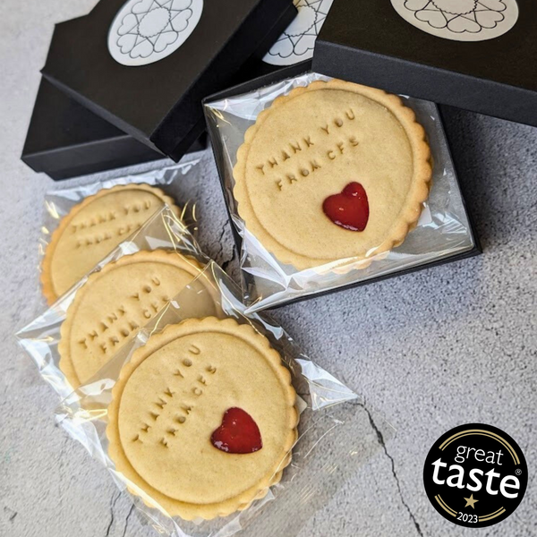 Personalised Jam Biscuits in Small Box: Shortbread biscuits with "Thank You" message and heart-shaped jam filling, presented in black gift boxes.