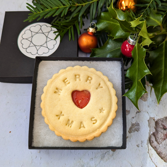 Personalised Jam Cookies in Small Box: A festive shortbread biscuit with a heart-shaped jam centre and the message "Merry Xmas".