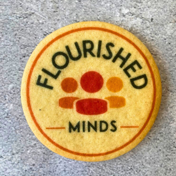 butter cookie printed with colourful "Flourished Minds" logo