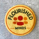 butter cookie printed with colourful "Flourished Minds" logo