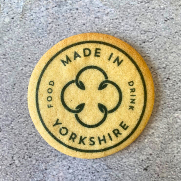 Delicious round biscuits printed with green "Food Cycle" and "Made in Yorkshire"