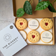 Alt text: Gift box of 6 branded biscuits: 3 jammy biscuits with "Thank You" and 3 with "The Biskery" logo.